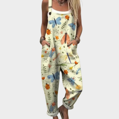 Light green printed overalls with colorful butterflies and insects, adjustable straps