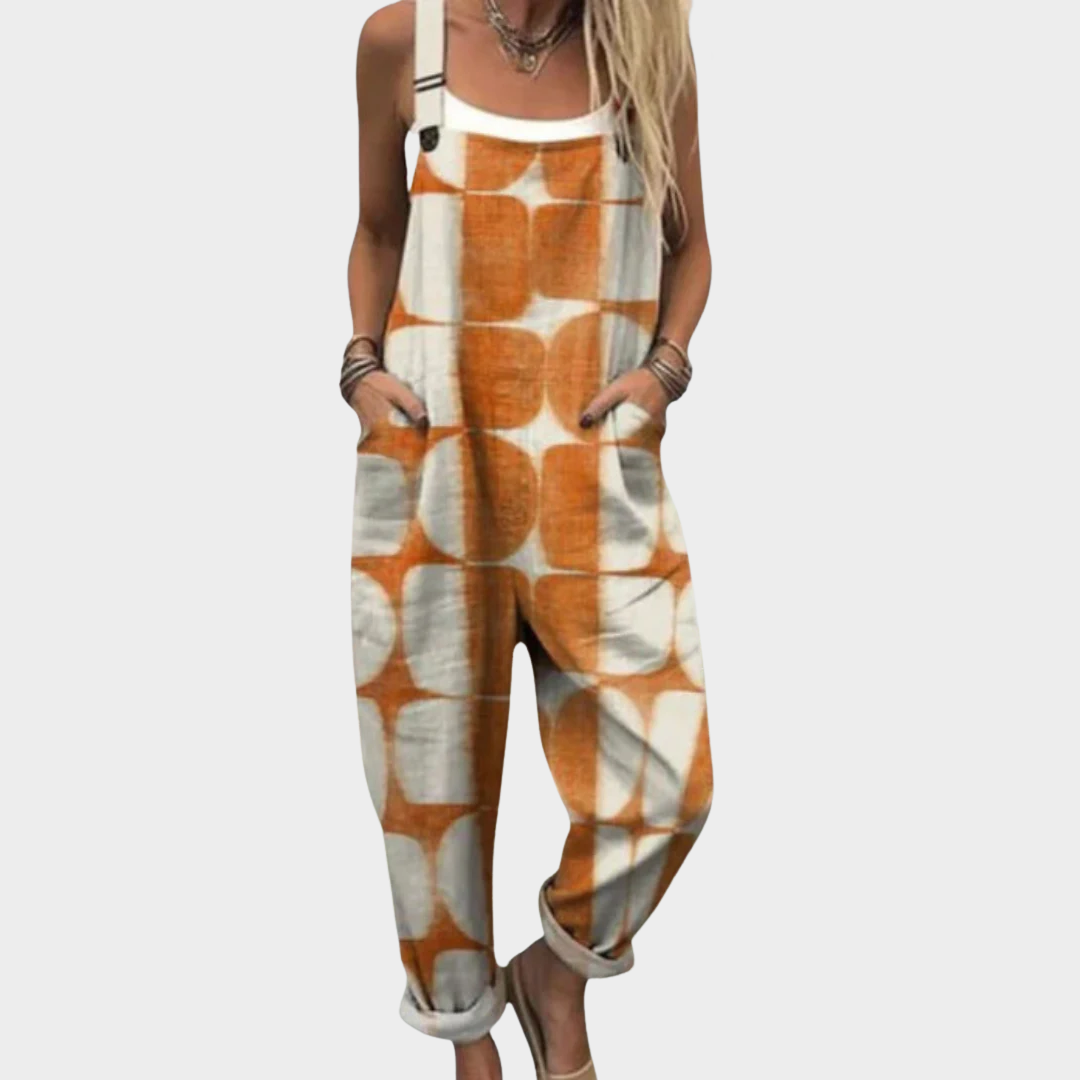 Printed sleeveless overalls with orange and white abstract pattern, adjustable straps