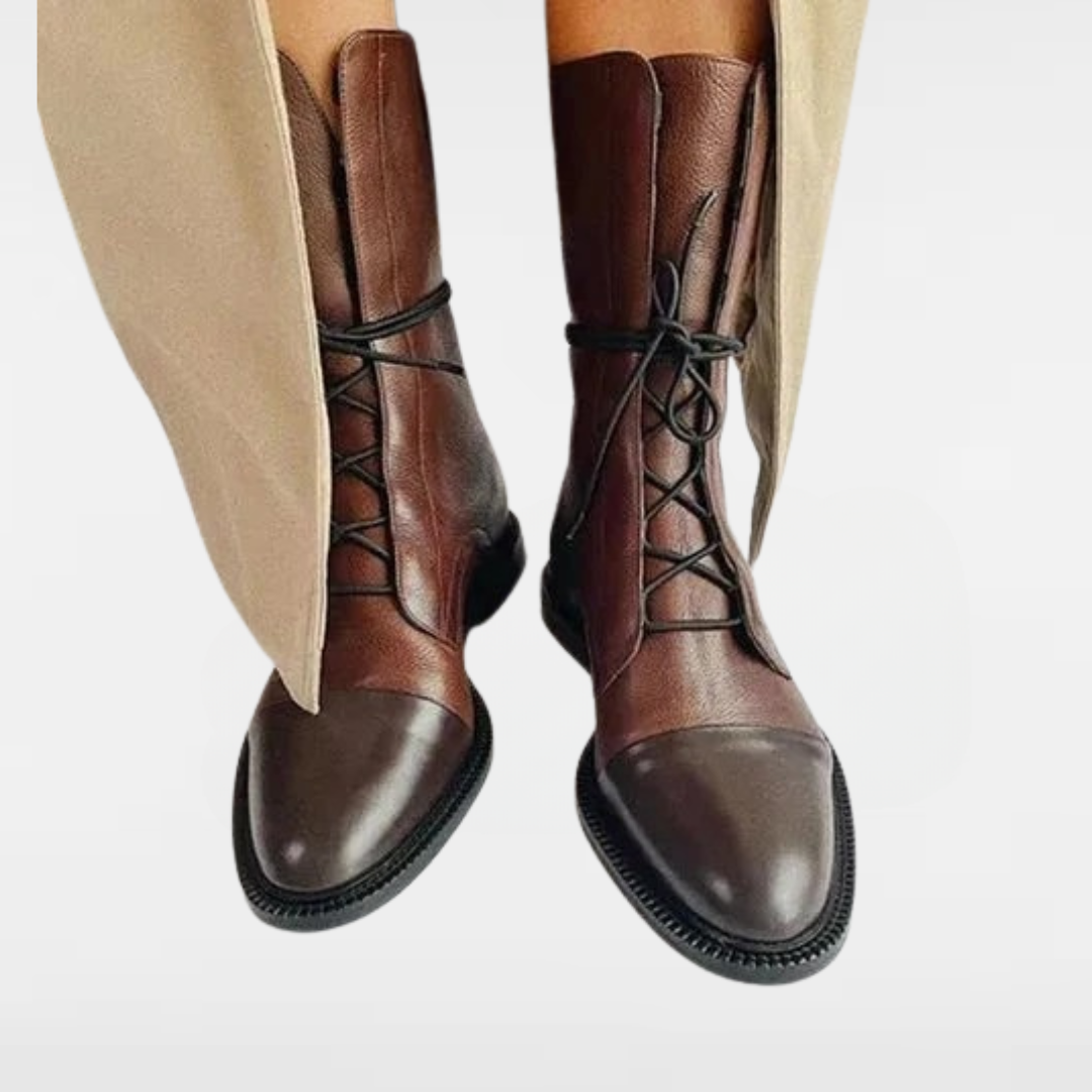 Brown lace-up ankle boots with black laces and thick sole