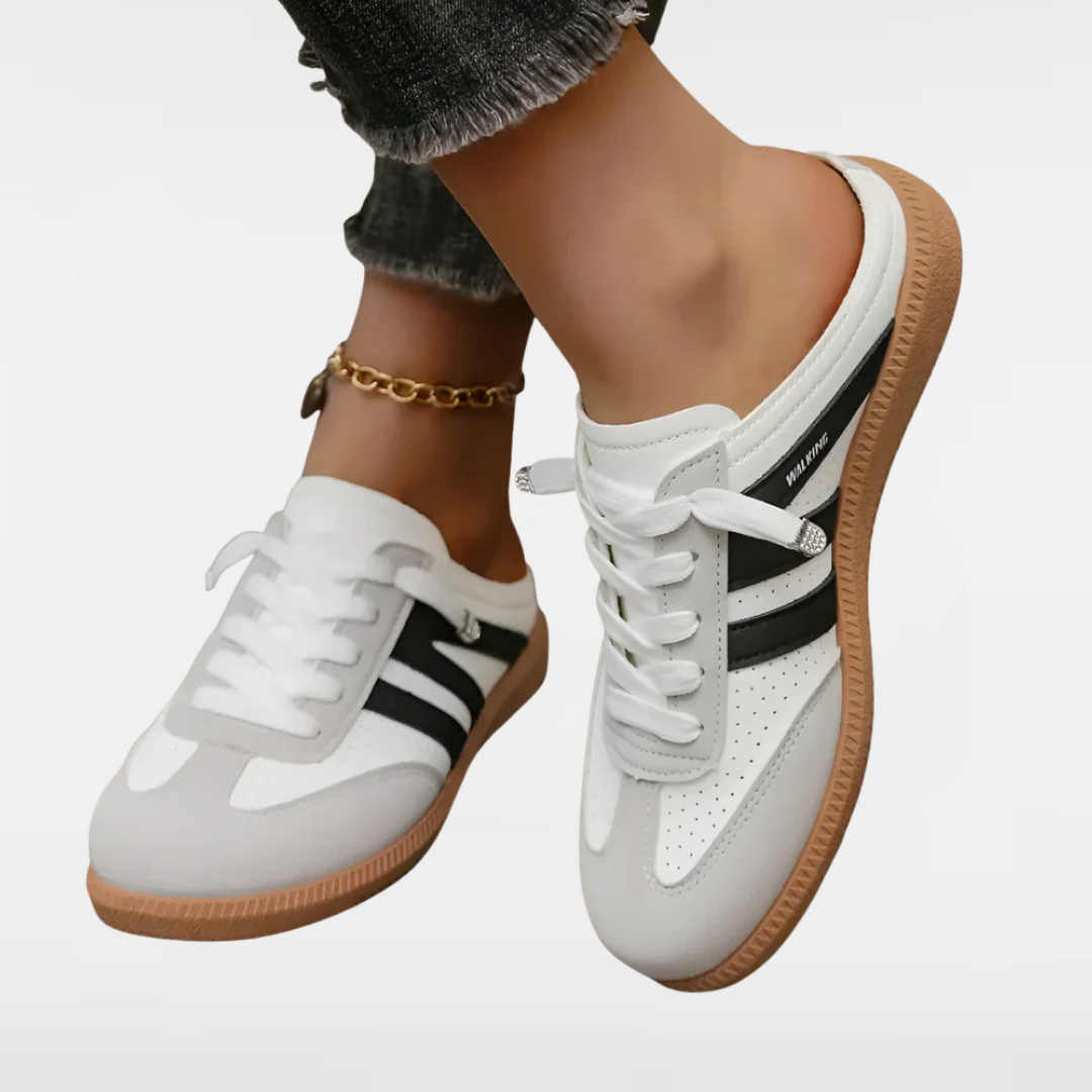White retro sneakers with black side stripes and gum sole, lace-up style.