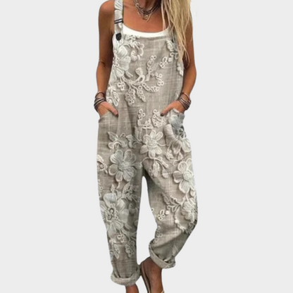Gray printed overalls with floral pattern, sleeveless bib front and wide legs