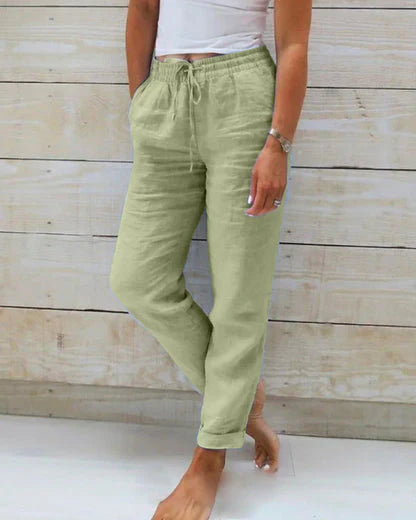Comfortable drawstring pants in light green with elastic waist and tapered ankle cuffs