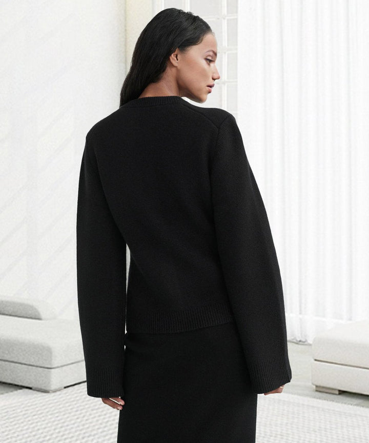 Black cardigan with ribbed back hem and long sleeves