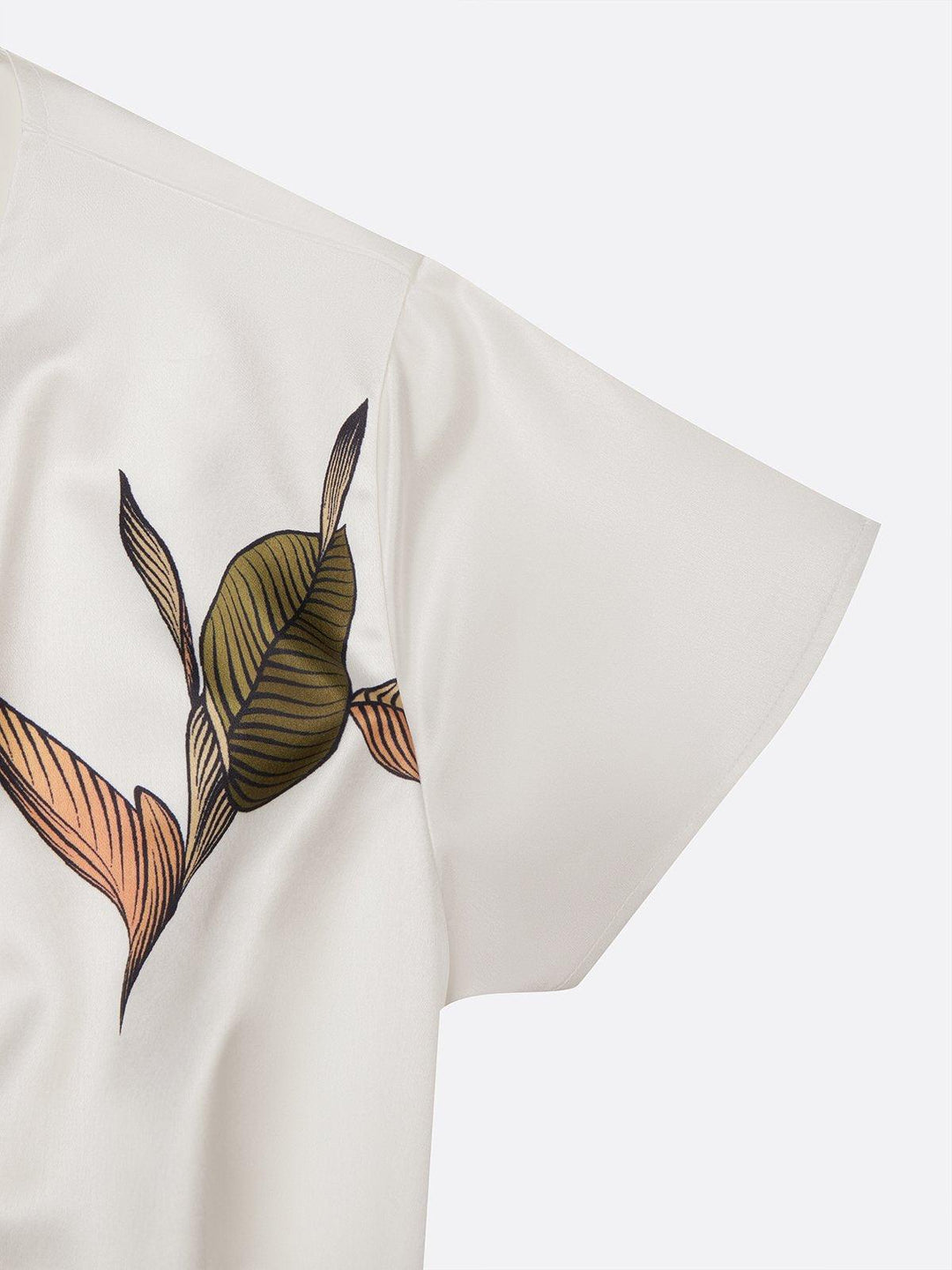 White short sleeve dress fabric with leaf print detail