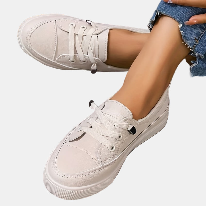 White lace-up platform sneakers with rounded toe and ribbed outsole