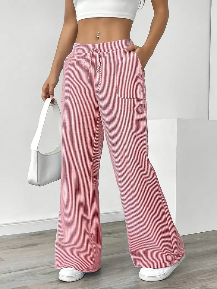 Pink striped wide-leg pants with elastic waist, drawstring, and side pockets