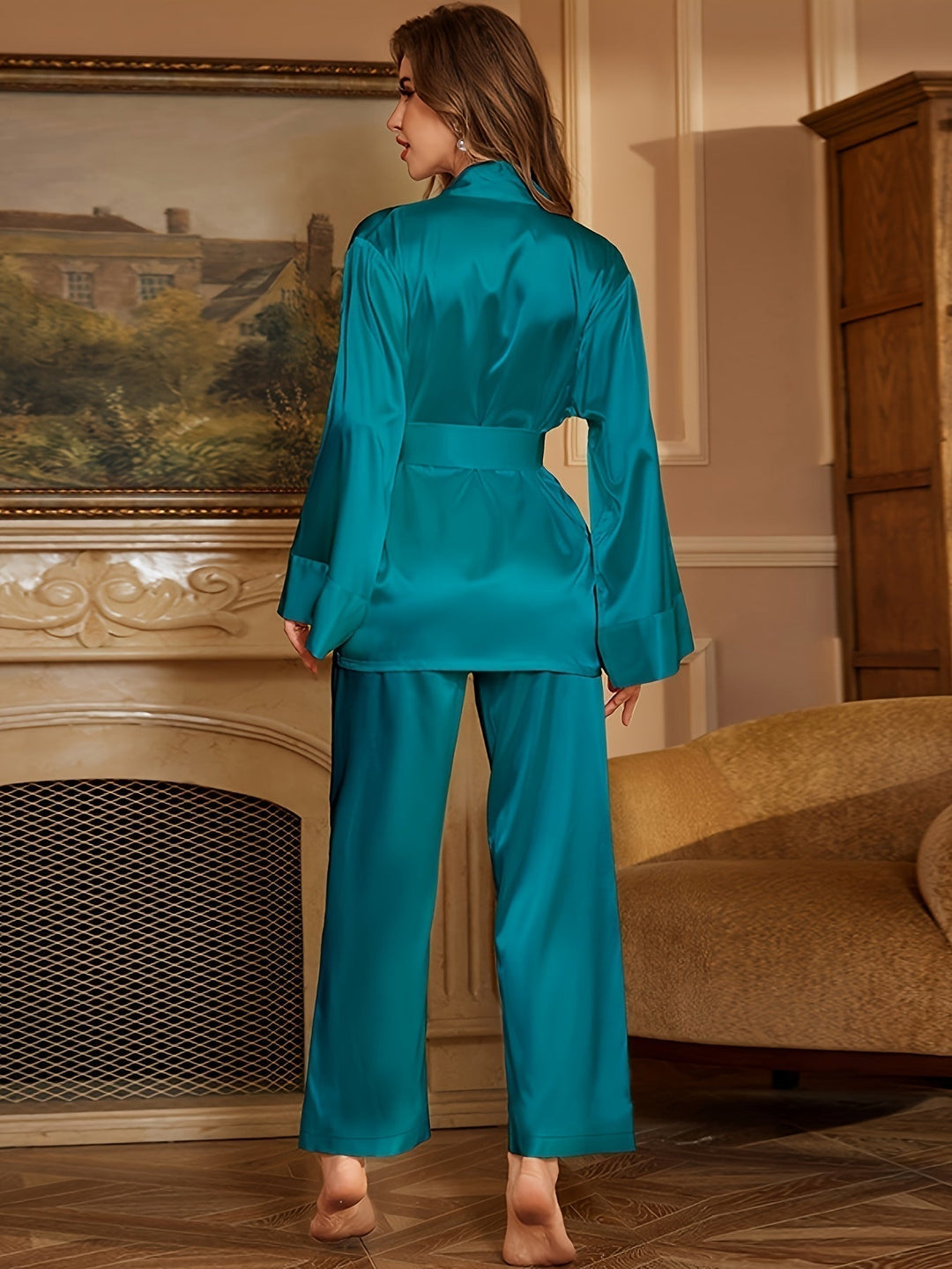 Women’s satin robe and pajama set in peacock blue, with belt and wide-leg pants (back view)