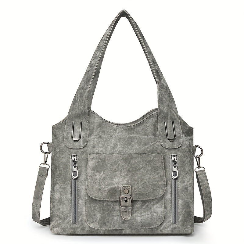 Grey suede-look shoulder bag with top handles, front flap pocket, and two zip pockets