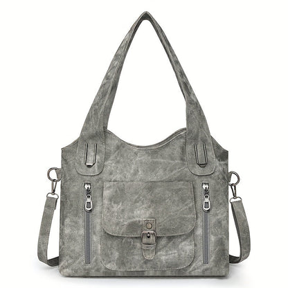 Grey suede-look shoulder bag with top handles, front flap pocket, and two zip pockets