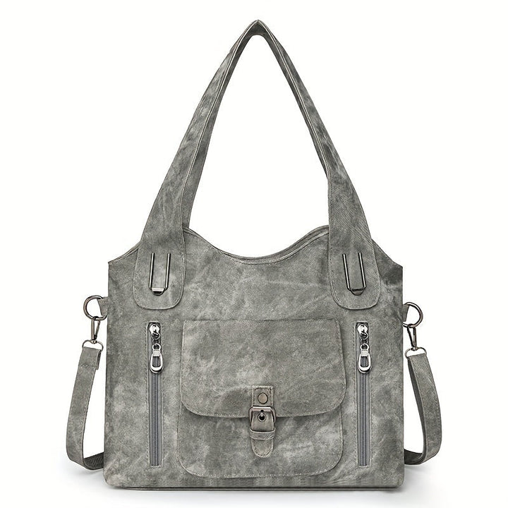 Grey suede-look shoulder bag with top handles, front flap pocket, and two zip pockets