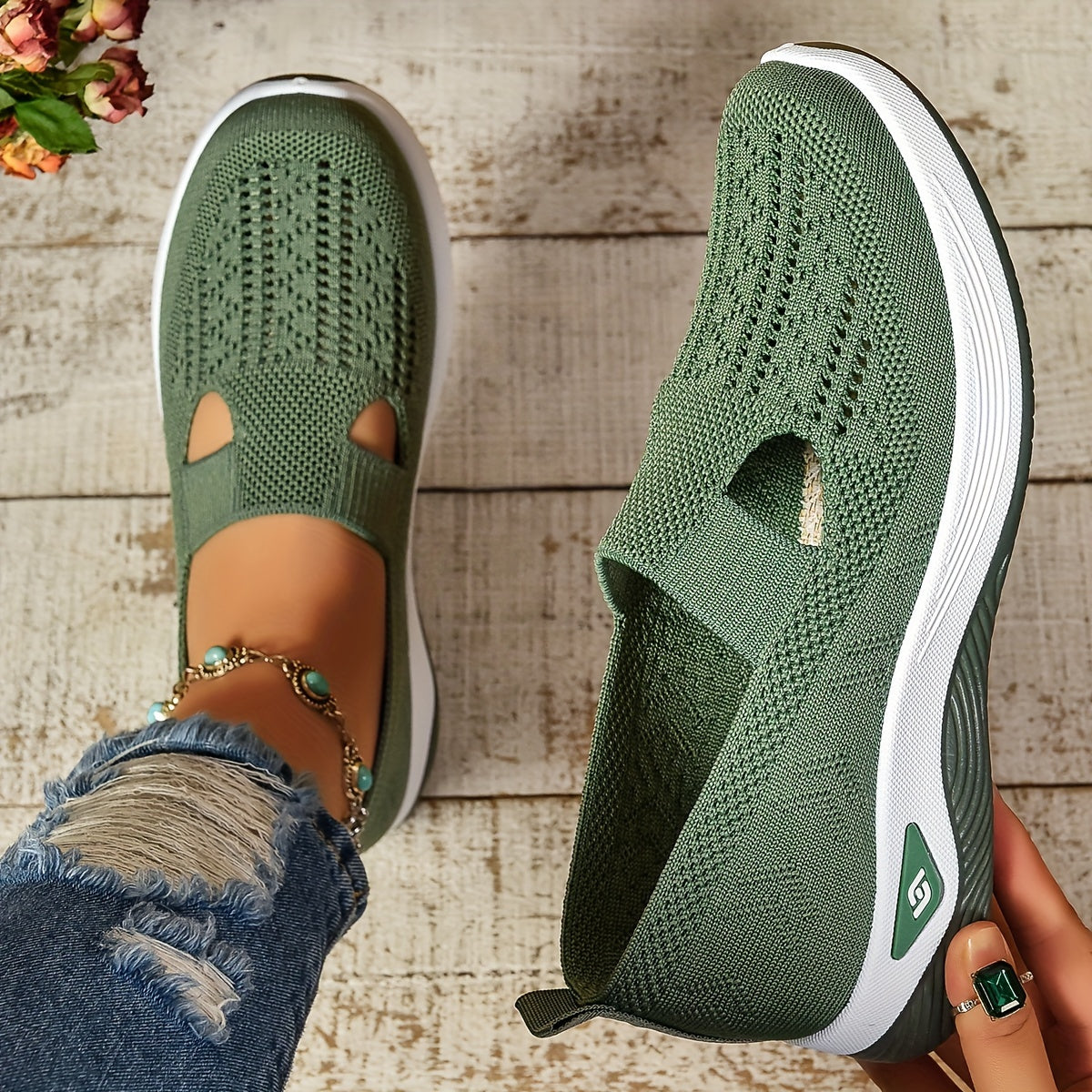 Green knit slip-on orthopedic shoes, side profile with cutout and white sole