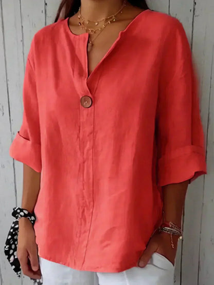 Red V-neck blouse with button front and elbow-length sleeves