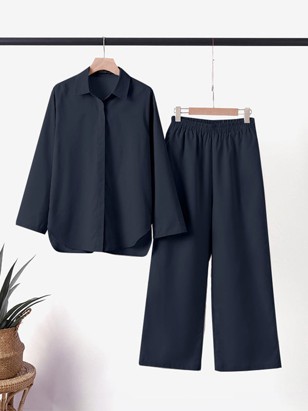 Navy two-piece set on hangers: button-up shirt and wide-leg trousers.
