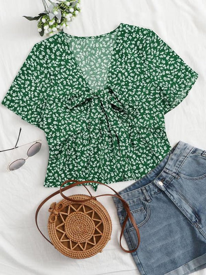 Green floral v-neck flowy top with short sleeves and tied front detail