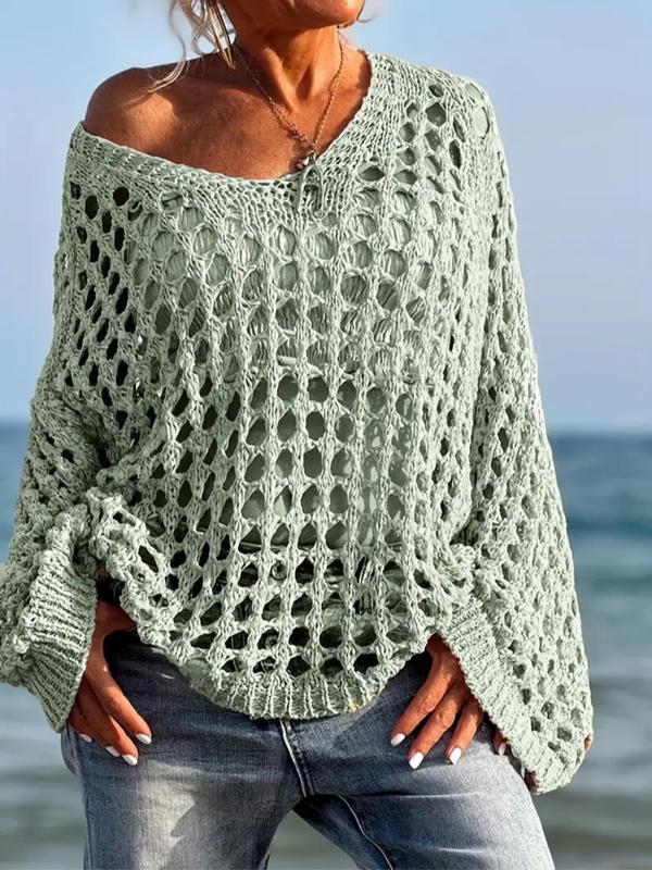 Comfy long-sleeve knit top in light green with openwork pattern and fringe trim