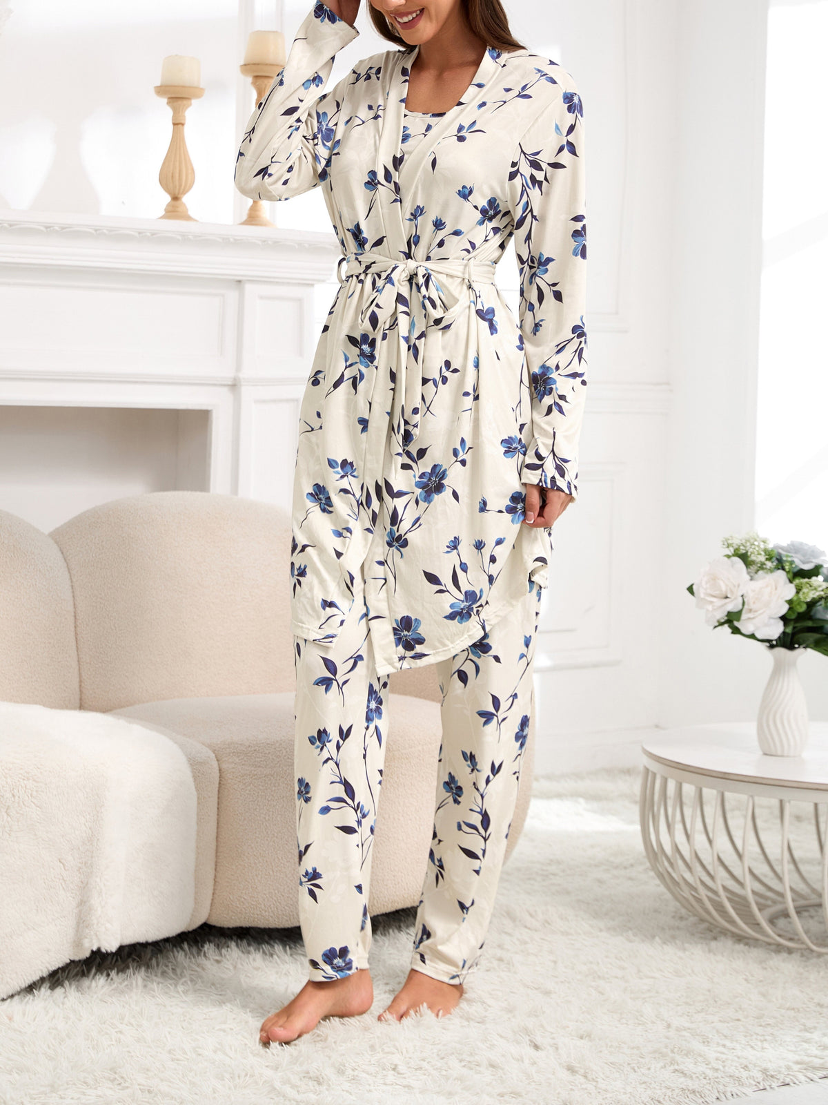 Women’s pajama set in cream with blue floral print, long belted top and tapered pants