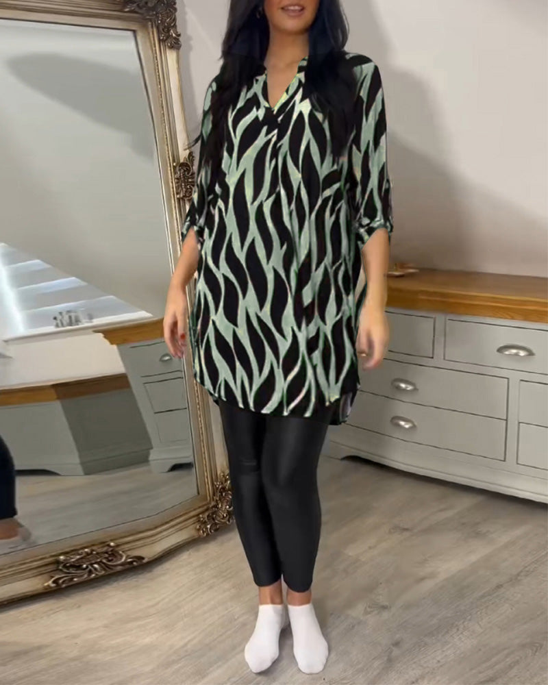Printed loose-fit top with V-neck and zebra-style abstract print, front view