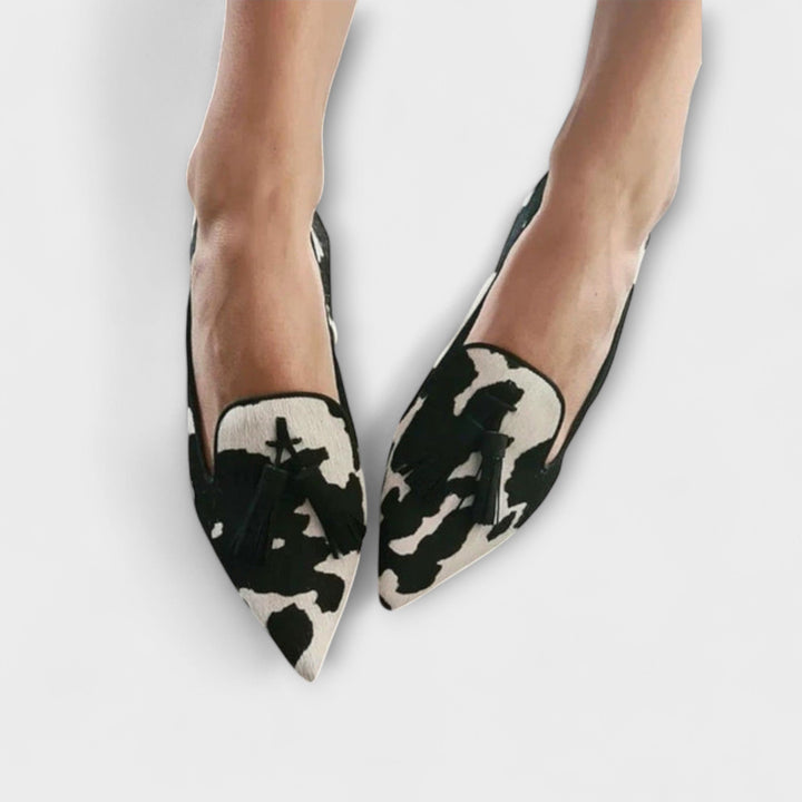 Steph elegant loafers with black-and-cream cow print, pointed toe, slip-on