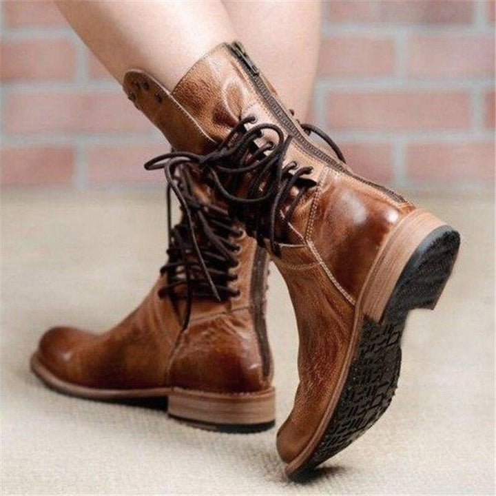 Brown leather lace-up boots with textured sole and stacked mid-height heel