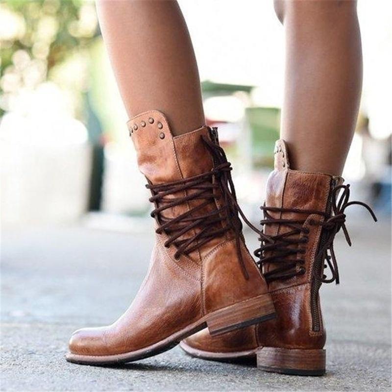 Brown leather lace-up boots with studded cuffs and short block heels.