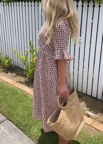 Brown dot-print summer dress with ruffled short sleeves and flower applique