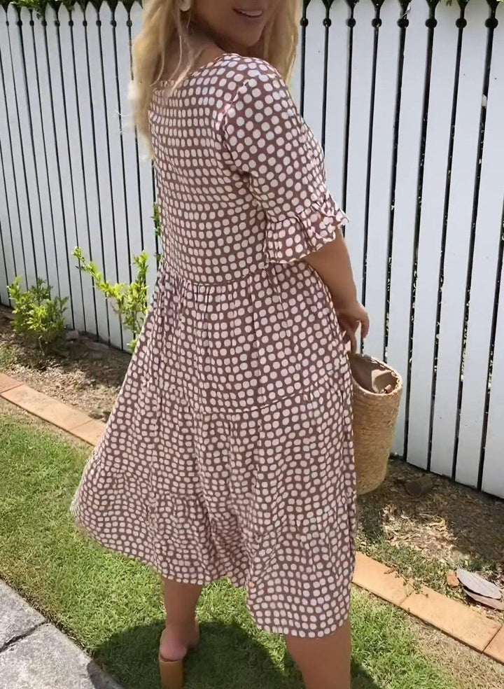 Brown dot-print summer dress with short puff sleeves, flower applique, tiered skirt