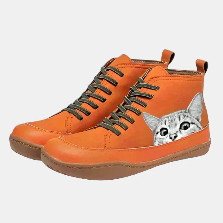 Orange lace-up orthopedic boots with gray cat face patch and cushioned sole