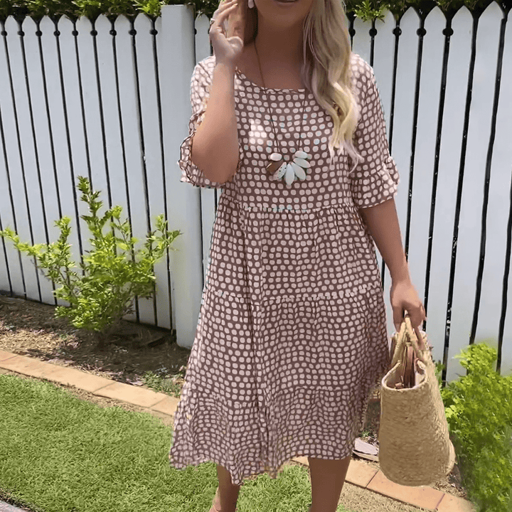 Brown dot-print summer dress with flower applique and tiered skirt