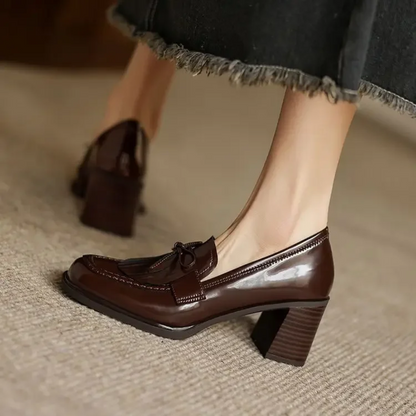 Brown loafer pumps with bow tassel detail and chunky block heel