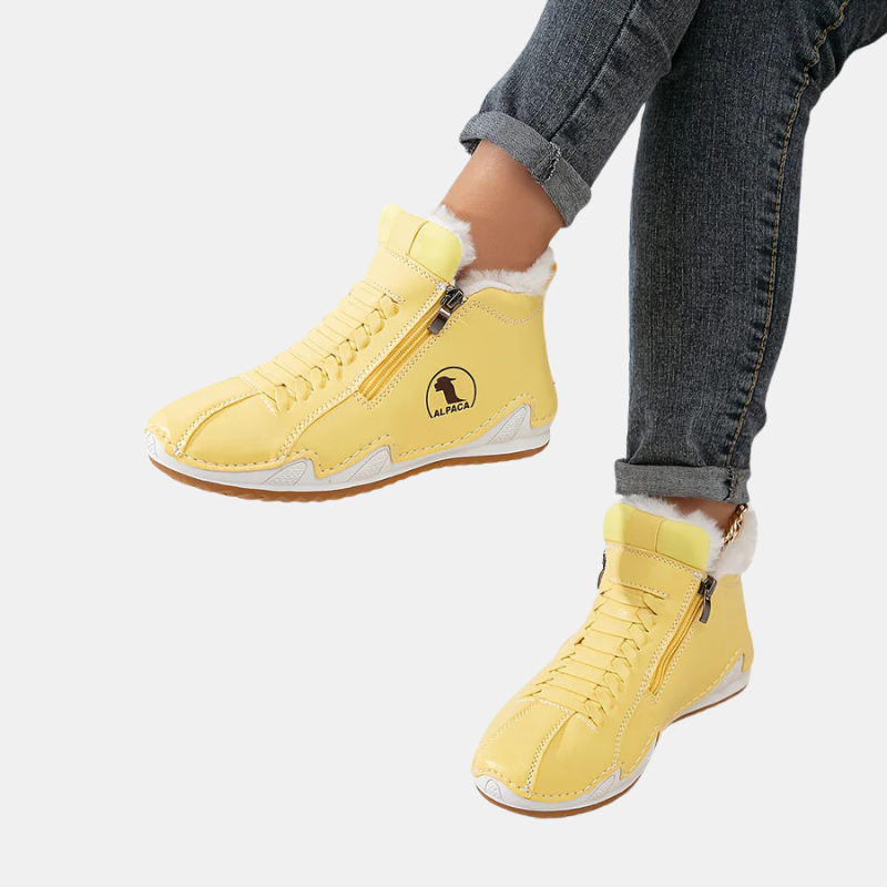 Yellow ankle boots with faux fur cuff, side zipper, lace-up front, and tan rubber sole.