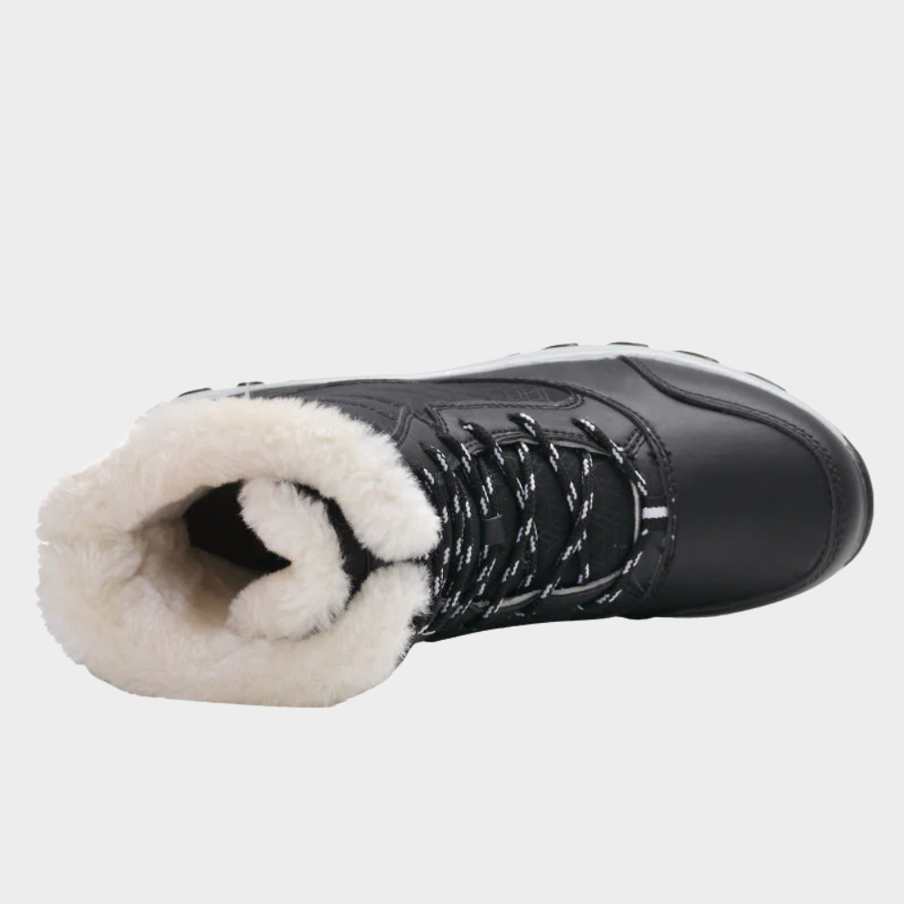 Black winter boots with lace-up front and plush white faux-fur lining at ankle.