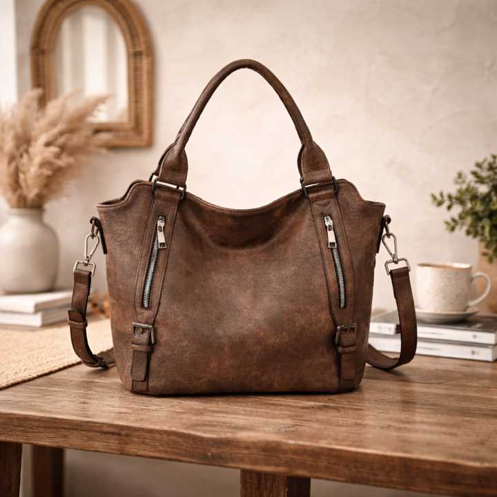 Brown leather-look shoulder tote bag with two front zip pockets and side straps