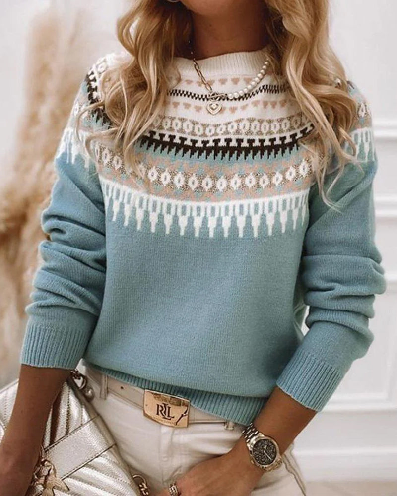 Teal Fair Isle knit sweater with patterned yoke and bands across the chest