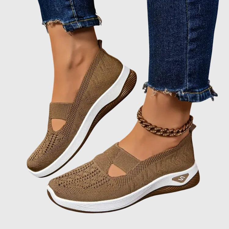 Beige slip-on orthopedic walking shoe, knit upper with open toe cutouts, white sole.