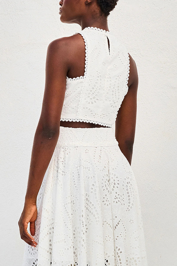 White embroidered sleeveless cropped top and high-waist maxi skirt set with eyelet texture