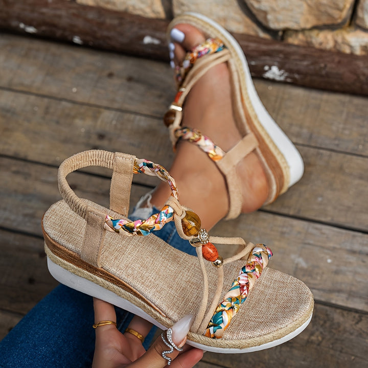 Beige orthopedic espadrille sandal with braided front strap and gold bead charm on side