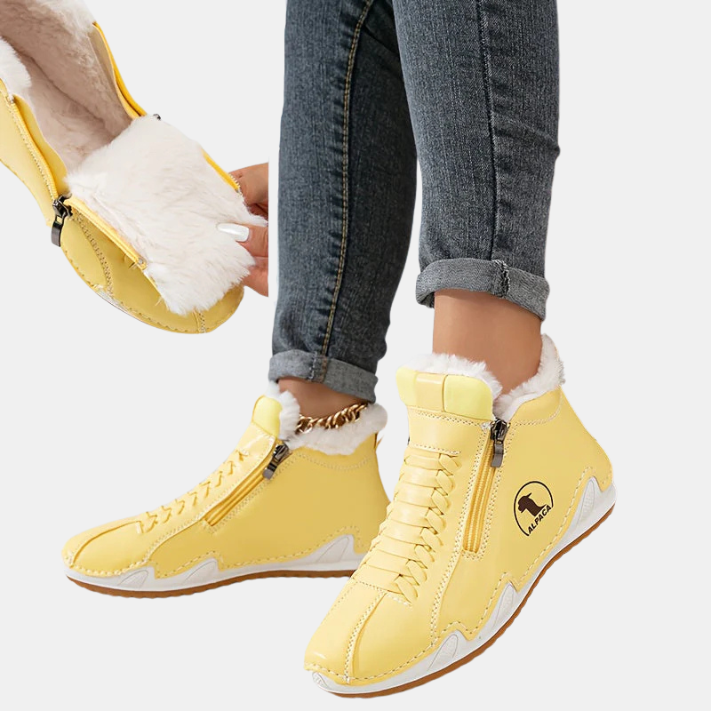 Yellow ankle boots with faux fur trim, side zipper, lace-up style, and tan sole.