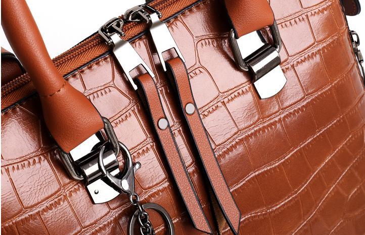 Brown crocodile-pattern handbag set with metal buckles and chain strap clips