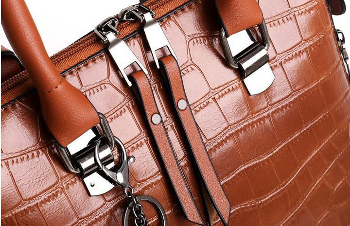 Brown crocodile-pattern handbag set with metal buckles and chain strap clips