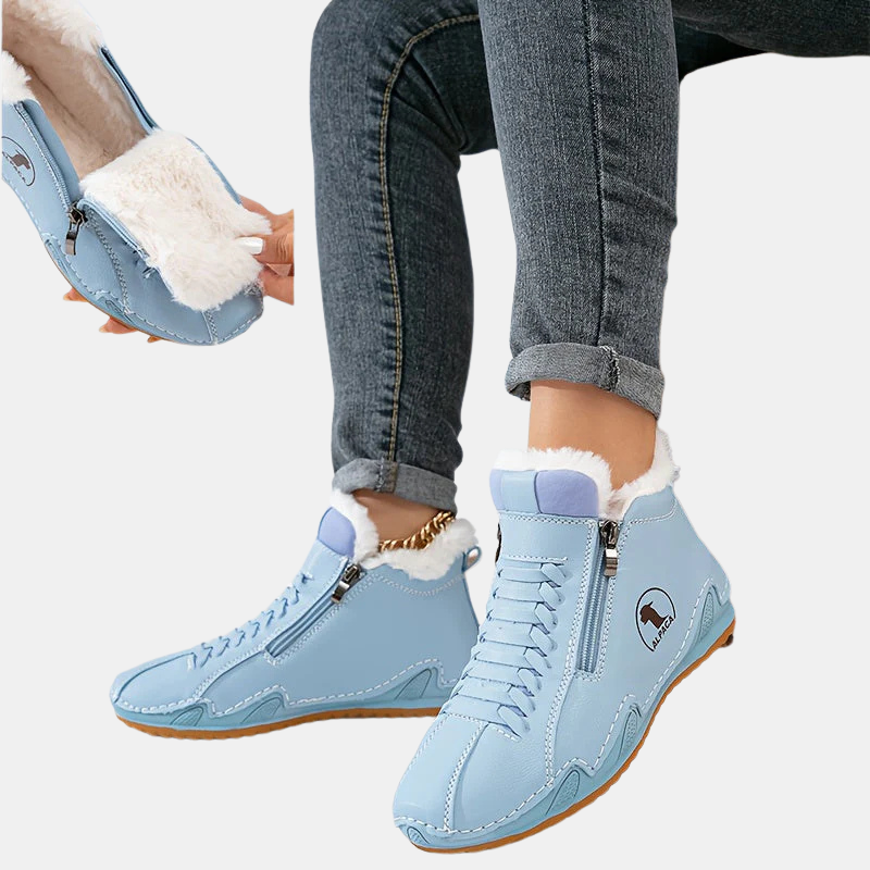 Light blue ankle boots with faux fur cuff, side zipper, lace-up front, and tan sole.