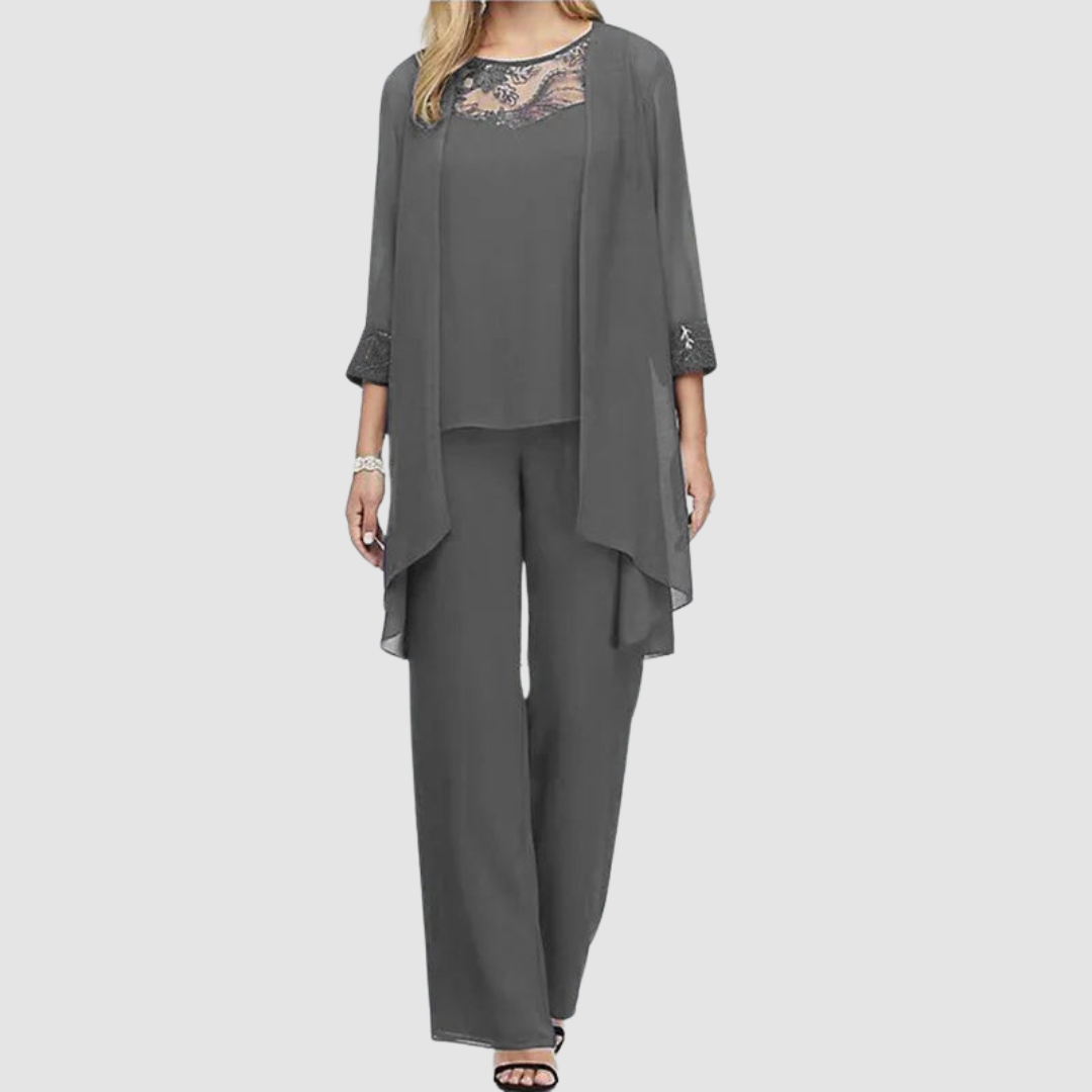 Charcoal three-piece set: lace-trim top, draped jacket, matching tapered trousers.