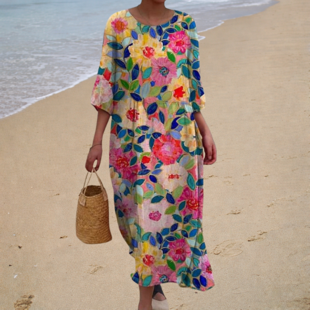 Floral long flowing dress with colorful leaves and flowers, elbow-length sleeves