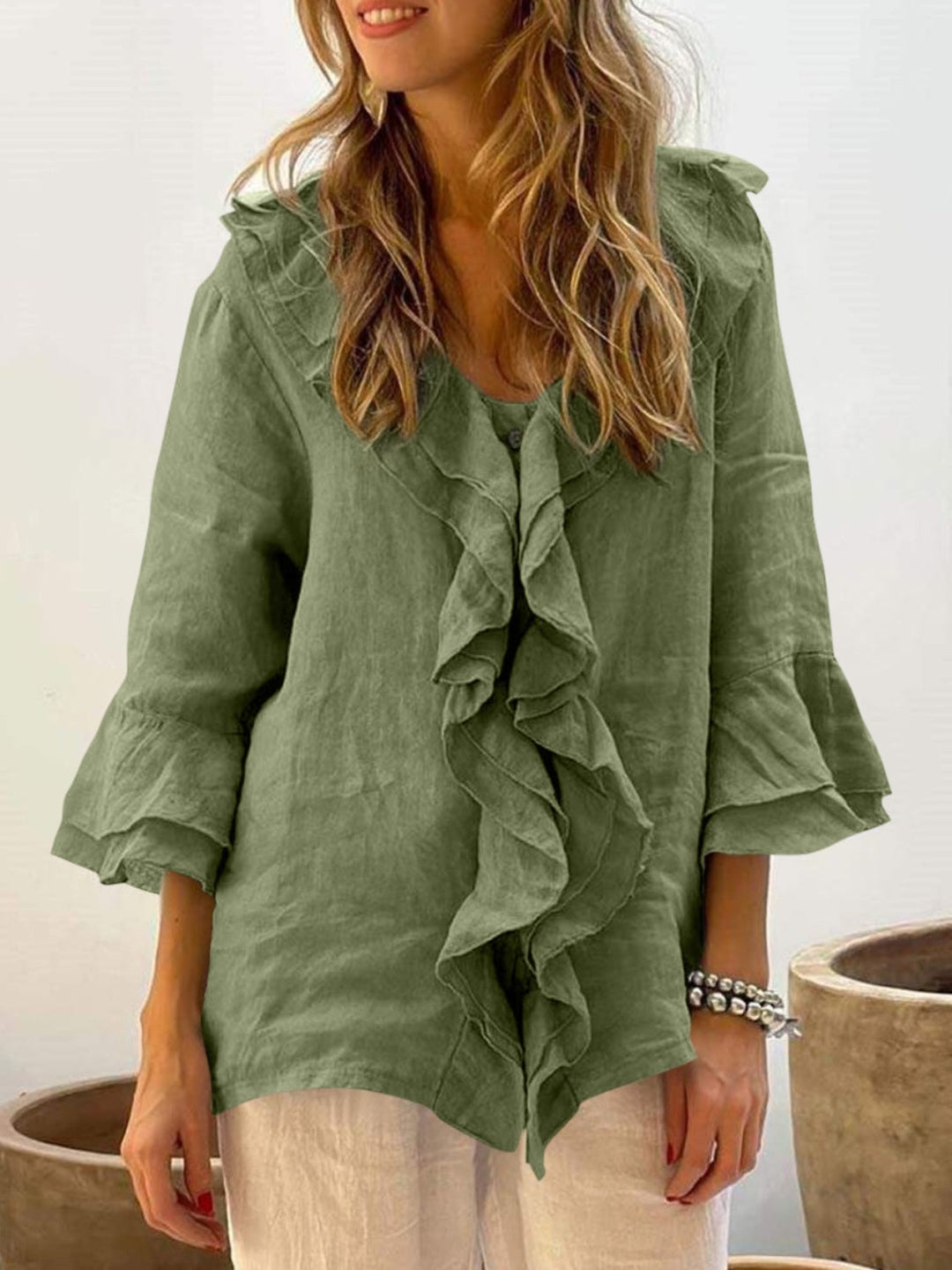 Women’s green ruffle bell-sleeve top with button placket and layered front