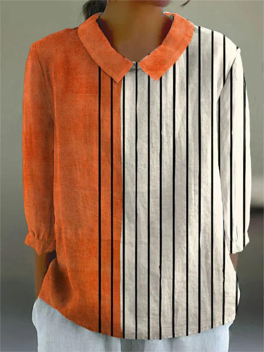 Contrast stripe blouse with orange collar/yoke and vertical black-and-white stripes