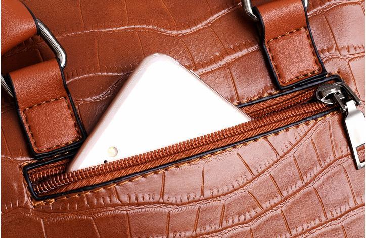 Brown crocodile-pattern bag pocket with zipper, metal trim, and inner card