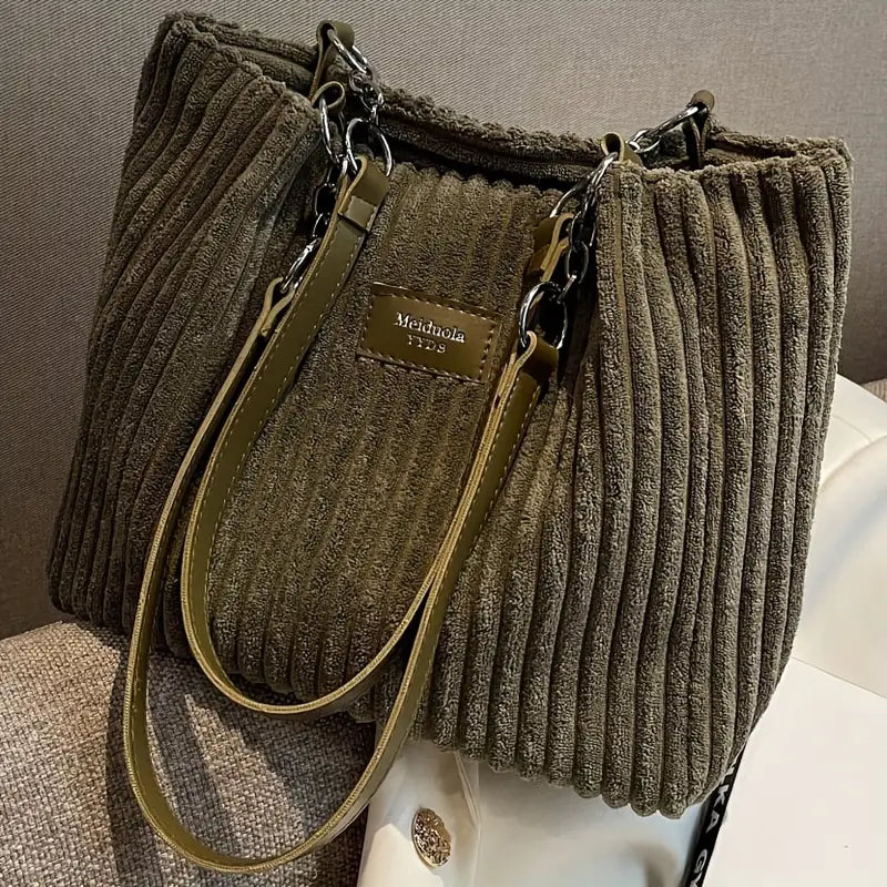 Olive green corduroy tote bag with zipper pocket and adjustable crossbody strap