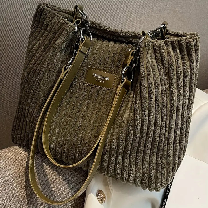 Olive green corduroy tote bag with zipper pocket and adjustable crossbody strap