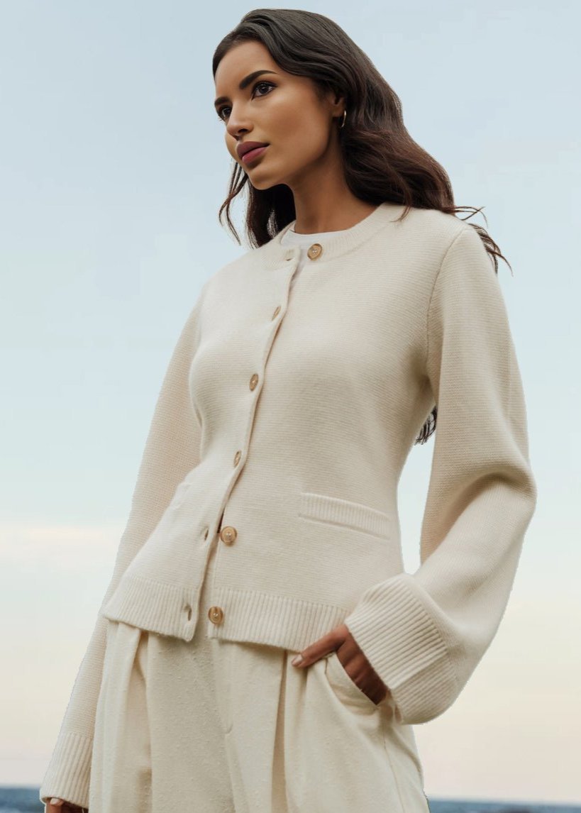 Cream cardigan with gold-tone buttons and ribbed hem