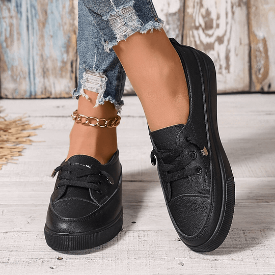 Black lace-up sneakers with padded collar and chunky rubber outsole