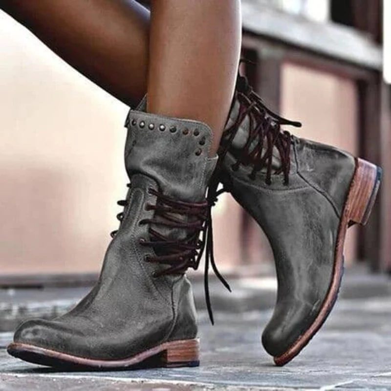 Dark grey leather lace-up boots with studded cuff and contrast brown outsole.